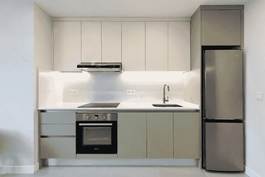 Light colors used to visually expand a small kitchen
